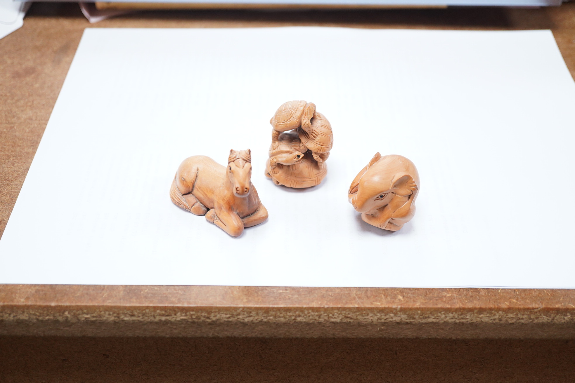 Three Japanese carved and signed boxwood netsukes, largest 5cm. Condition - two tortoises missing heads